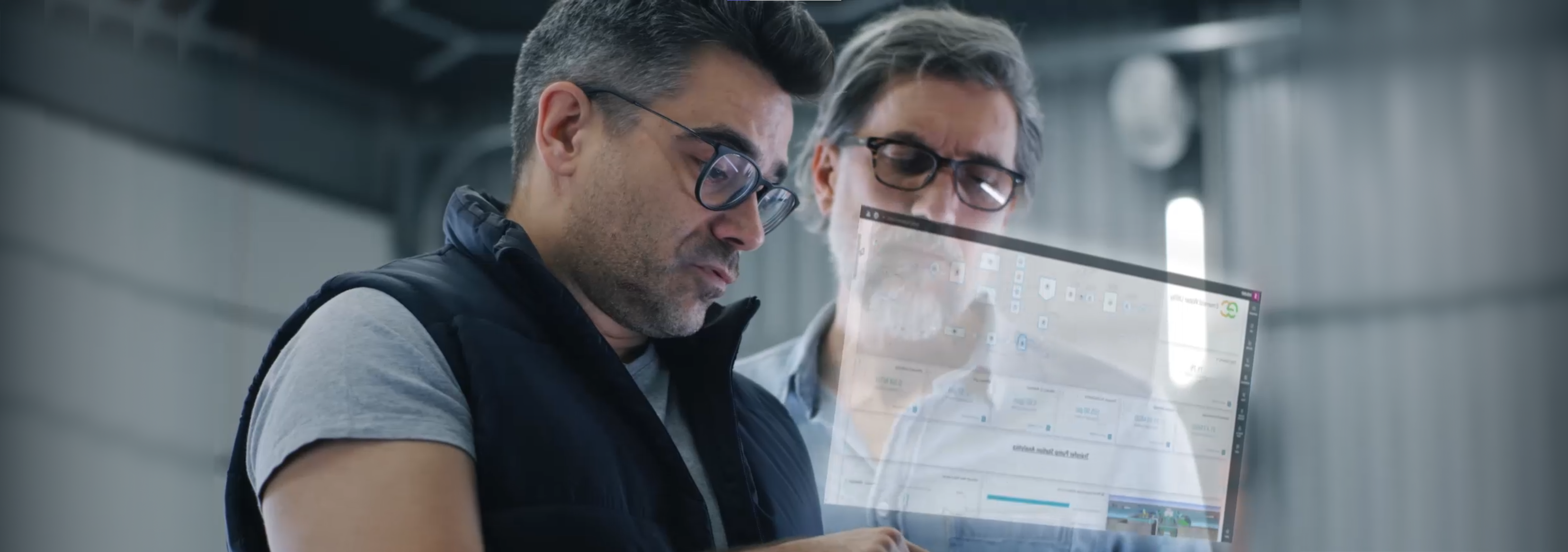 Two architects working over a floating Info 360 interface screen.